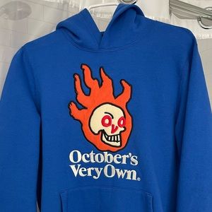 OVO (October’s Very Own) blue hoodie with flaming skull logo.